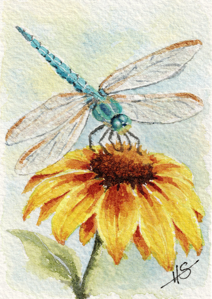 Watercolor painting of a blue-green dragonfly perched on a yellow and orange flower, with a soft pale blue and green background and a visible artist signature in the lower right.