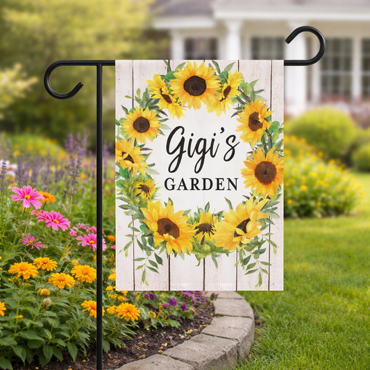 Decorative garden flag with sunflowers and 'Gigi's Garden' text in a garden setting.