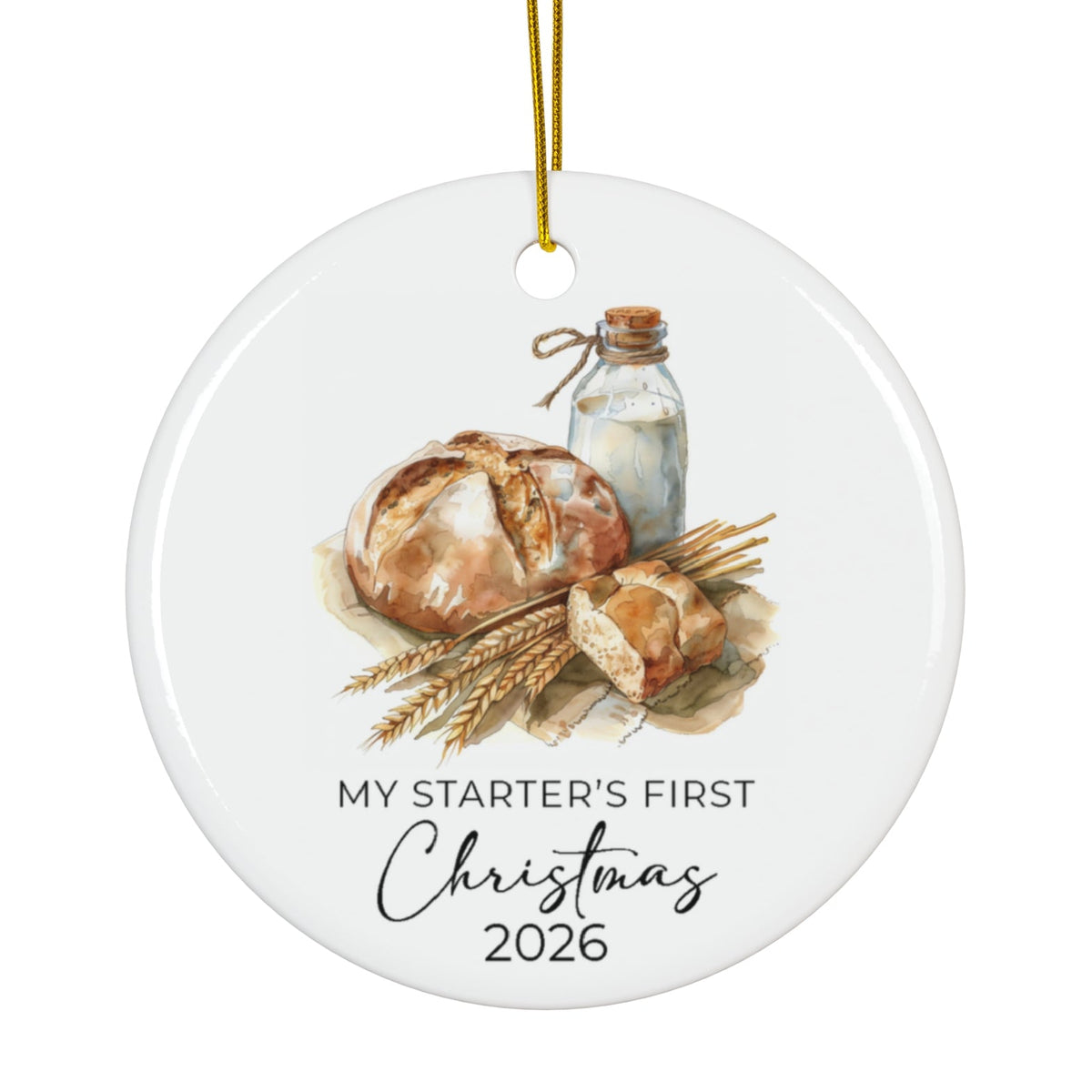 A round white ceramic Christmas ornament with a gold hanging string, featuring a watercolor illustration of bread, wheat, and a glass bottle, with the text 'MY STARTER'S FIRST Christmas 2026' printed below.
